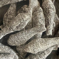 Close-up of Haribo Salt Fish – chewy sugar-coated salty liquorice herrings