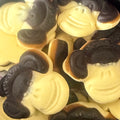 Close-up of Katja Banana Liquorice Monkeys – yellow and black monkey-shaped Dutch liquorice sweets